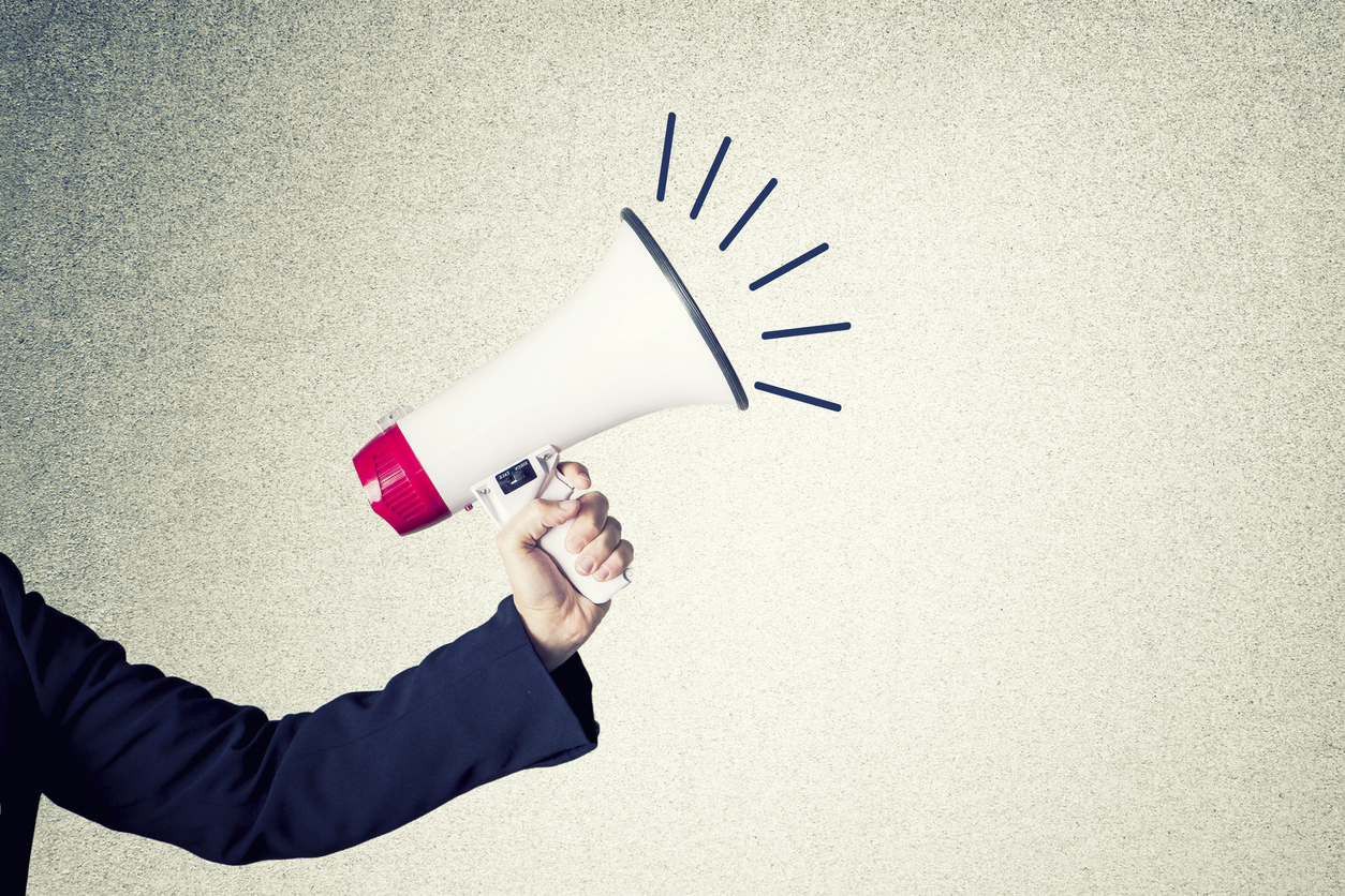 hand and a megaphone Studer Education